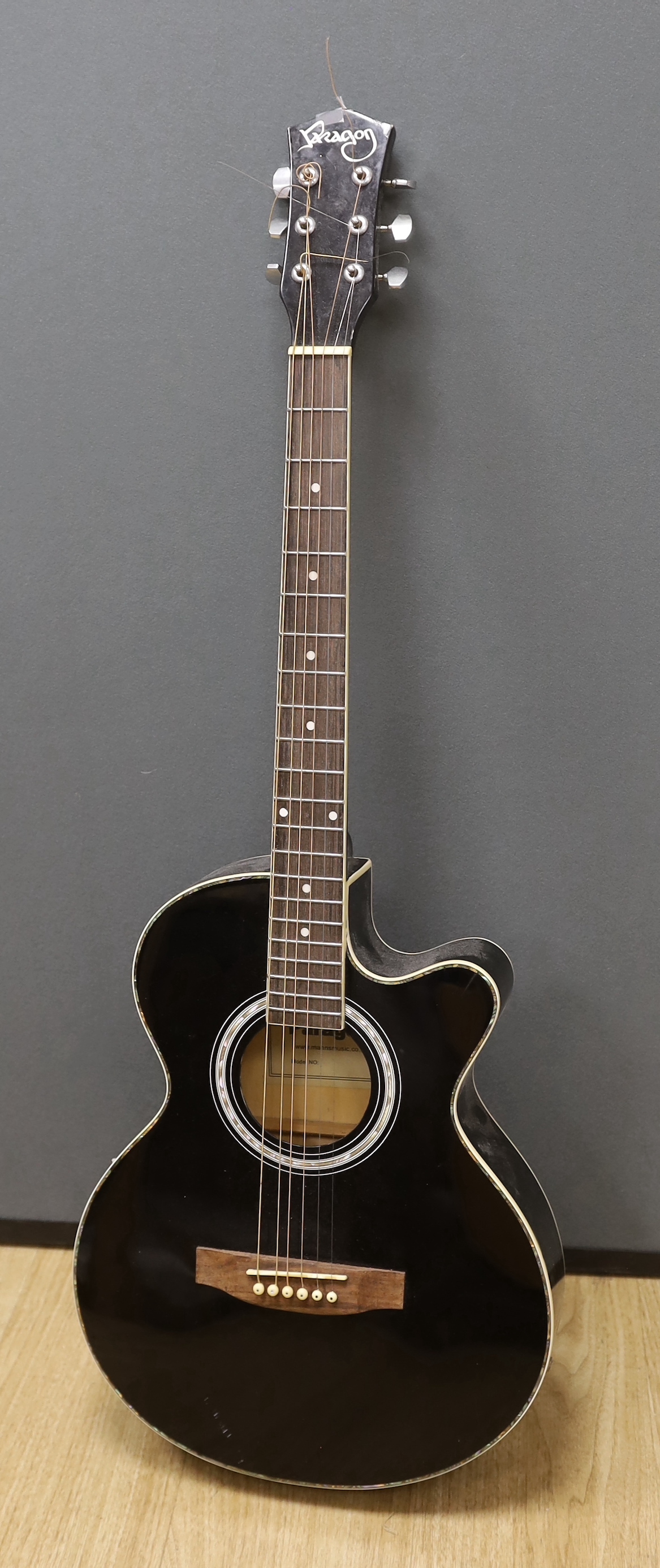 A Paragon electro-acoustic guitar